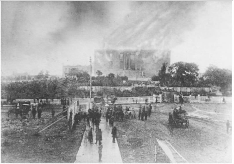 The first permanent Capitol in Austin burning in 1881
